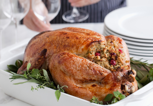  A stuffed turkey on a bed of leafy greens