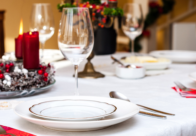 A festive table setting with white tablecloths