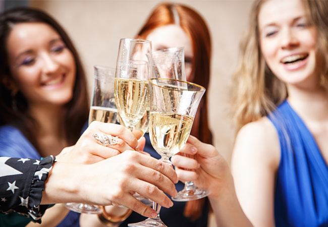 three ladies toasting a glass of champagne